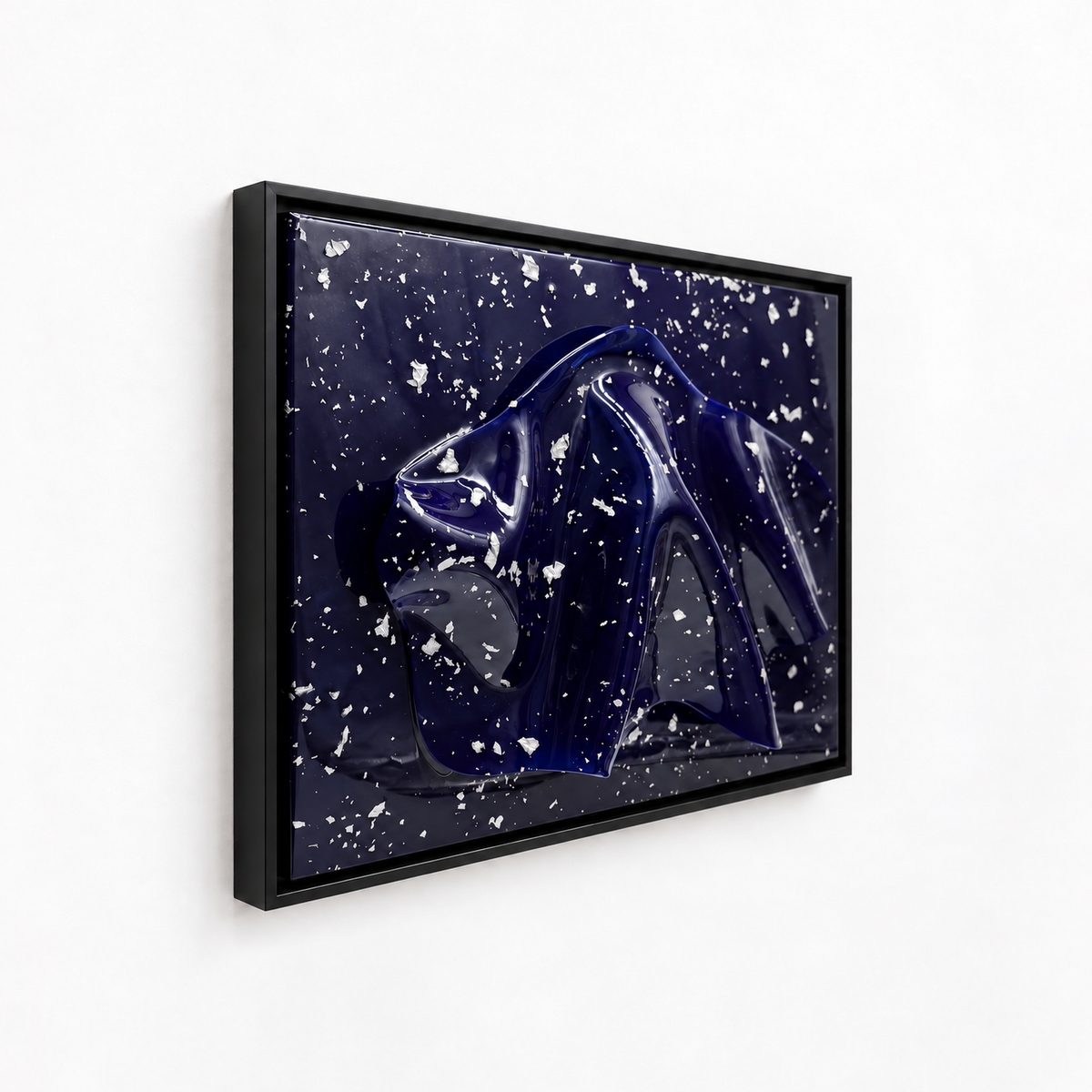 Midnight abstract art print featuring a glossy dark blue panther head silhouette against a deep navy background speckled with white stars, housed in a black frame and shown hanging on a white wall.